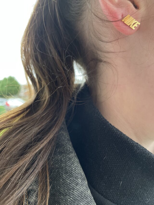 Gold Plated Nike Spell Out Stud Earrings