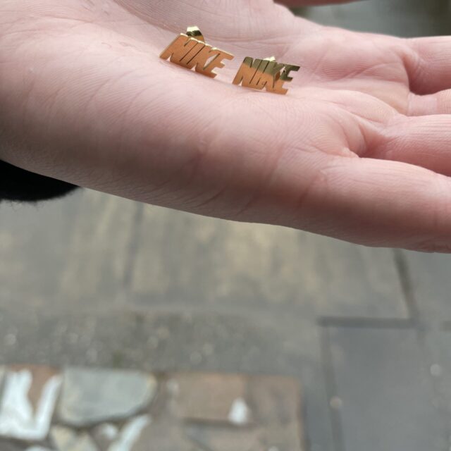 Gold Plated Nike Spell Out Stud Earrings